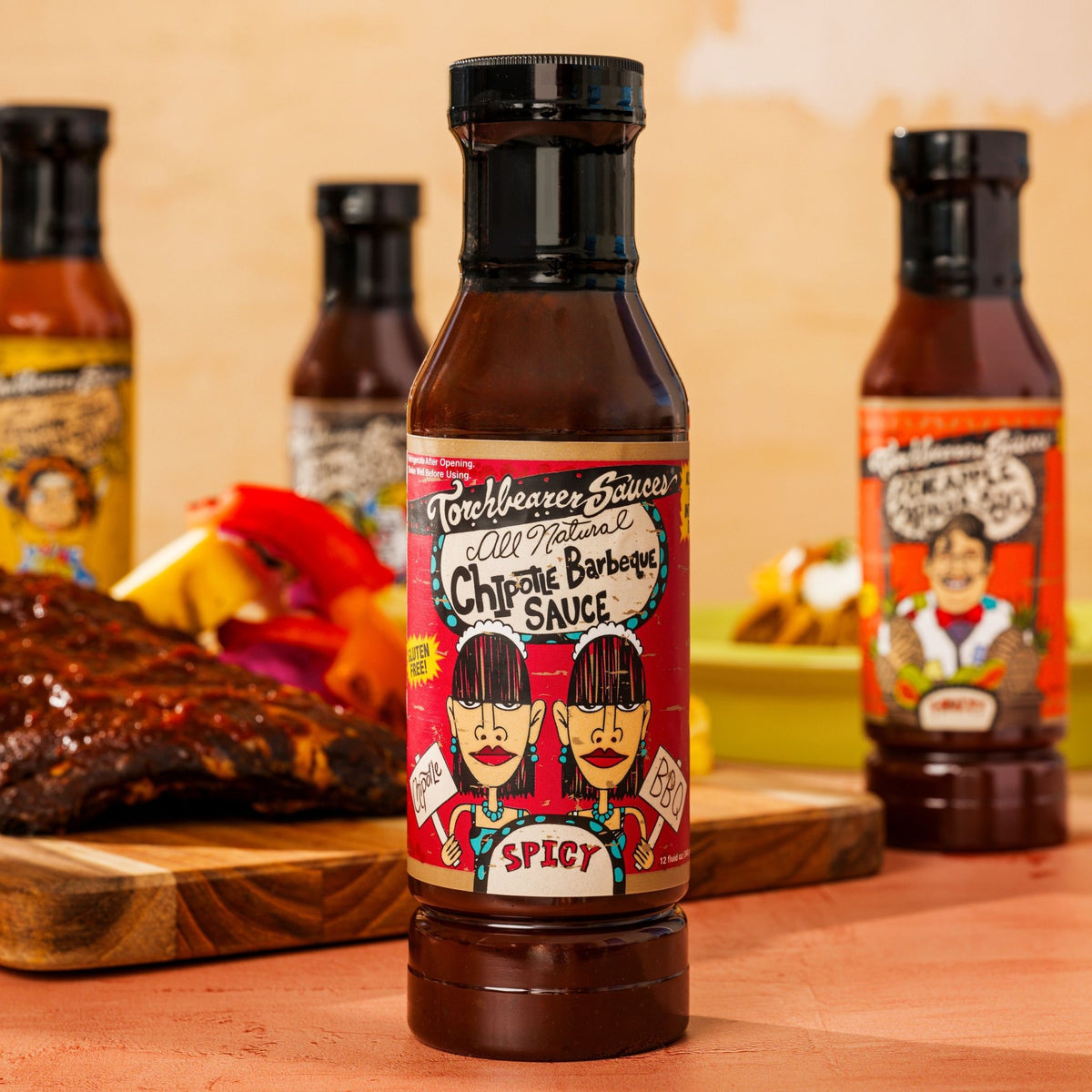 TorchBearer hot sauce bottles with food.