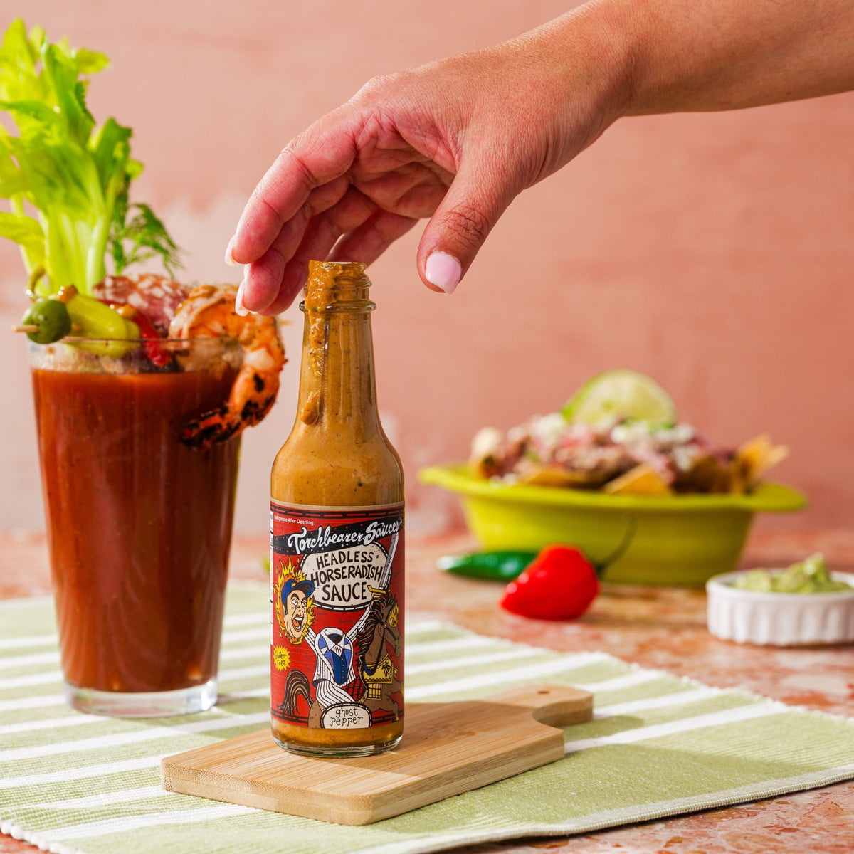 Headless Horseradish Hot Sauce person holding - TorchBearer Sauces