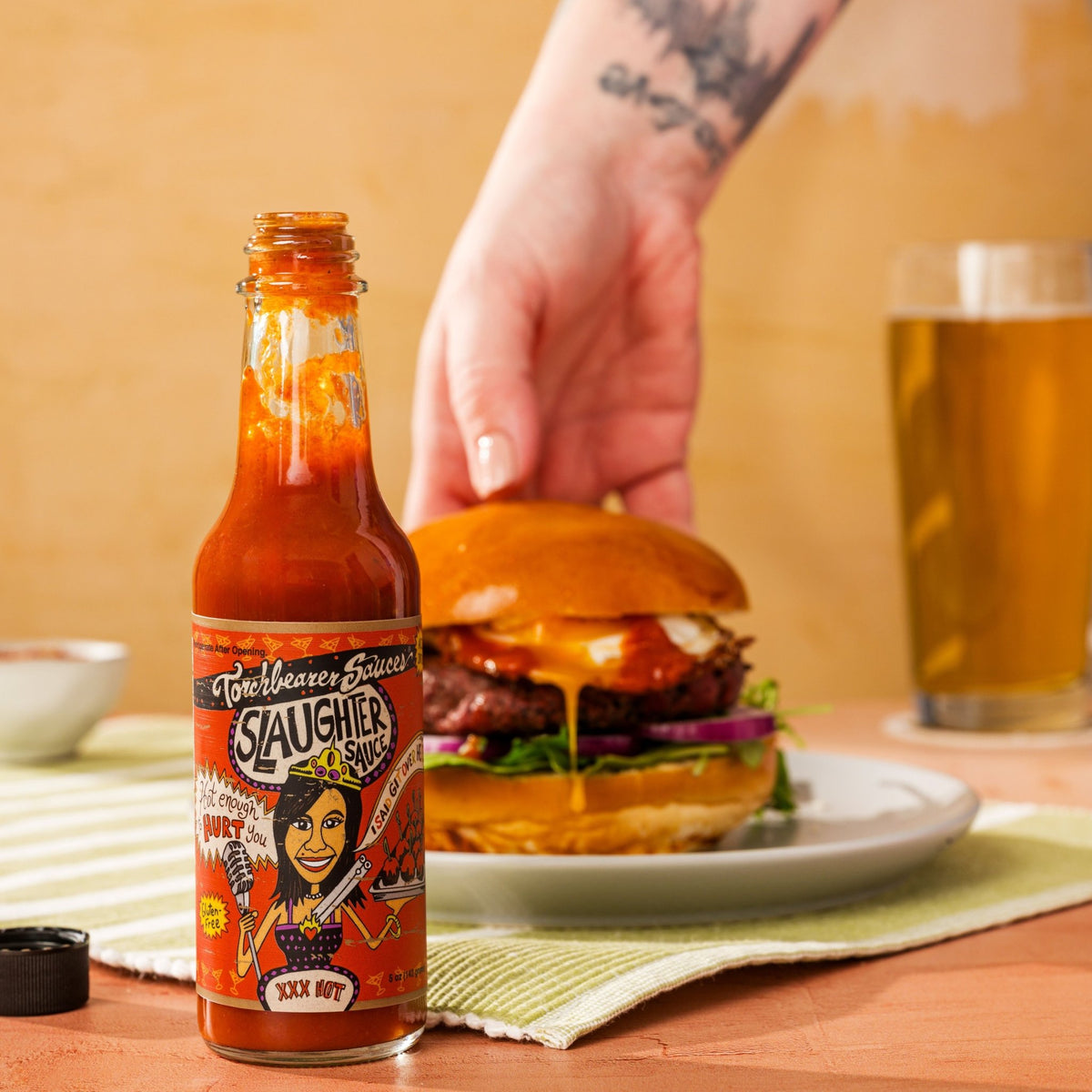 TorchBearer Habanero Slaughter Sauce™ with burger