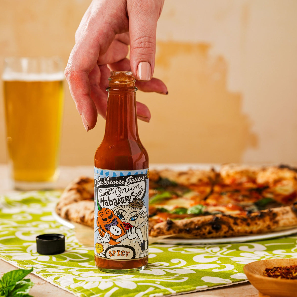 Sweet Onion Habanero sauce person holding